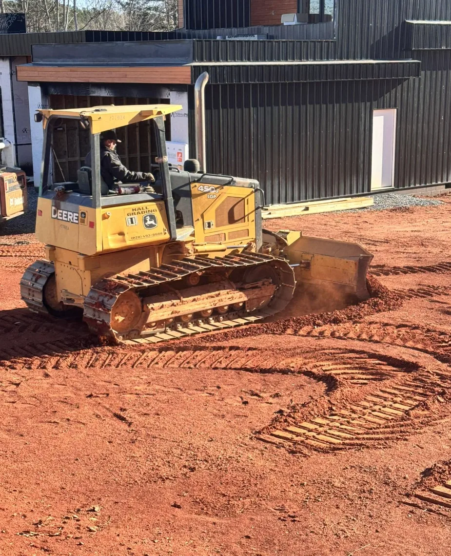Dozer Grading Beside Modern Home — Platinum Construction & Crane